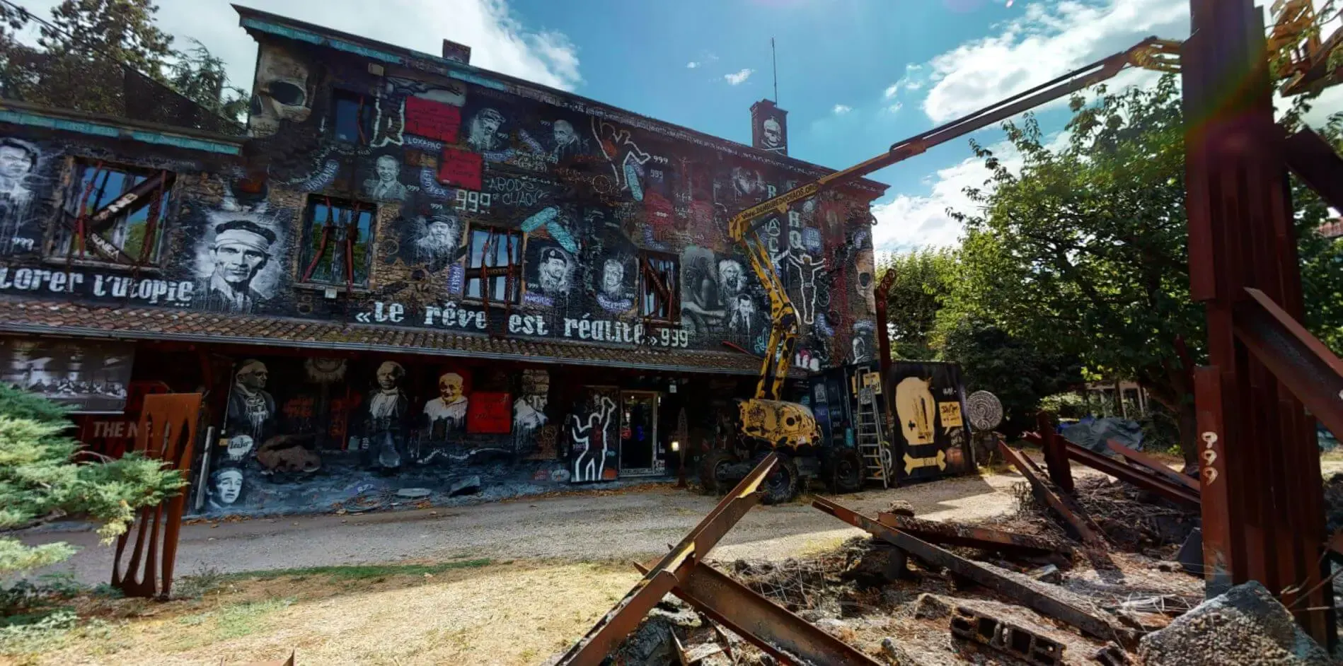 Painted façade and metal sculptures of the Demeure du Chaos in Saint-Romain-au-Mont-d'Or